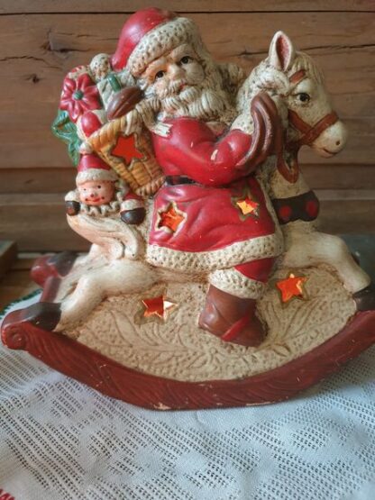 Waxinelichthouder Kerstman op hobbelpaard