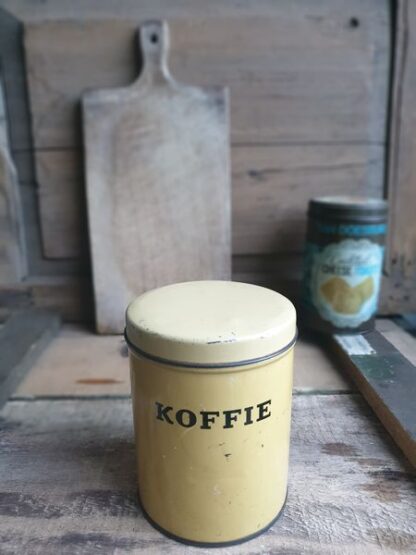 Oud geel blik koffie